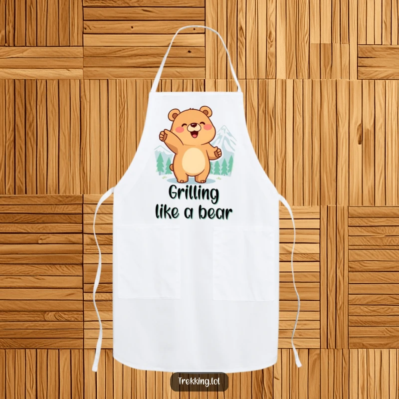 Funny apron with a smiling bear pointing at a mountain peak, ready to guide culinary adventures with enthusiasm.