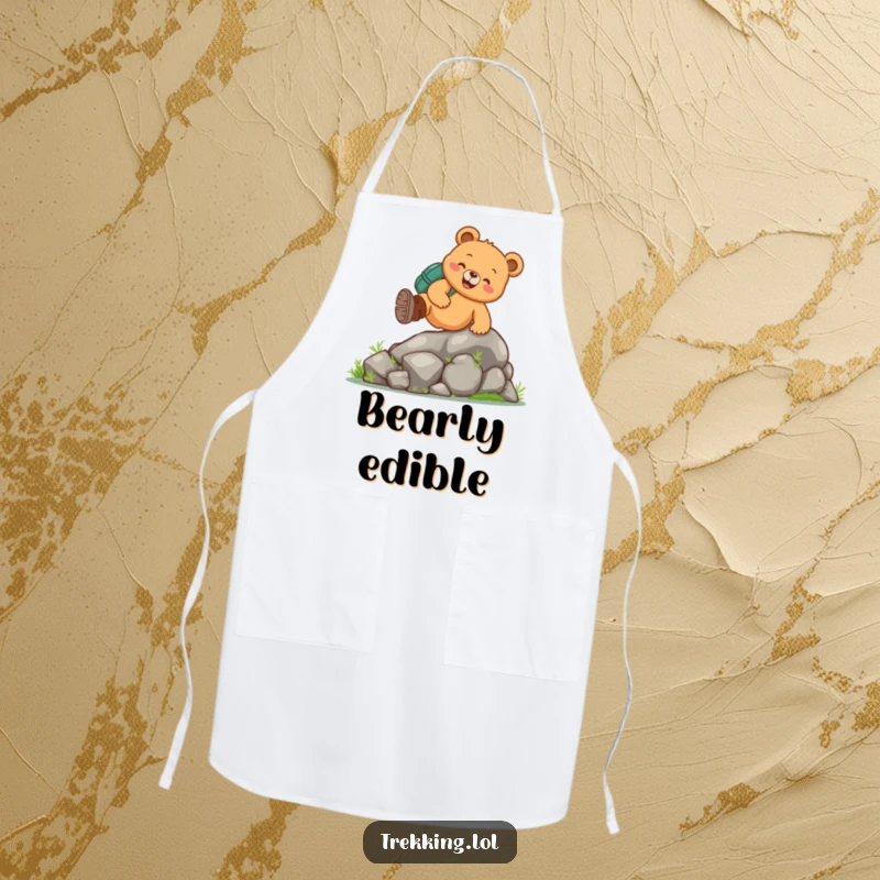 Funny bear hiking apron with a cheerful bear in boots tackling a mossy rock, ideal for humorous kitchen activities.