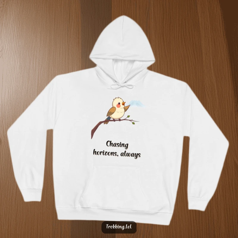Funny Hoodie with a cheerful bird on a branch, its beak pointing towards a faraway mountain, symbolizing direction and aspiration with humor.