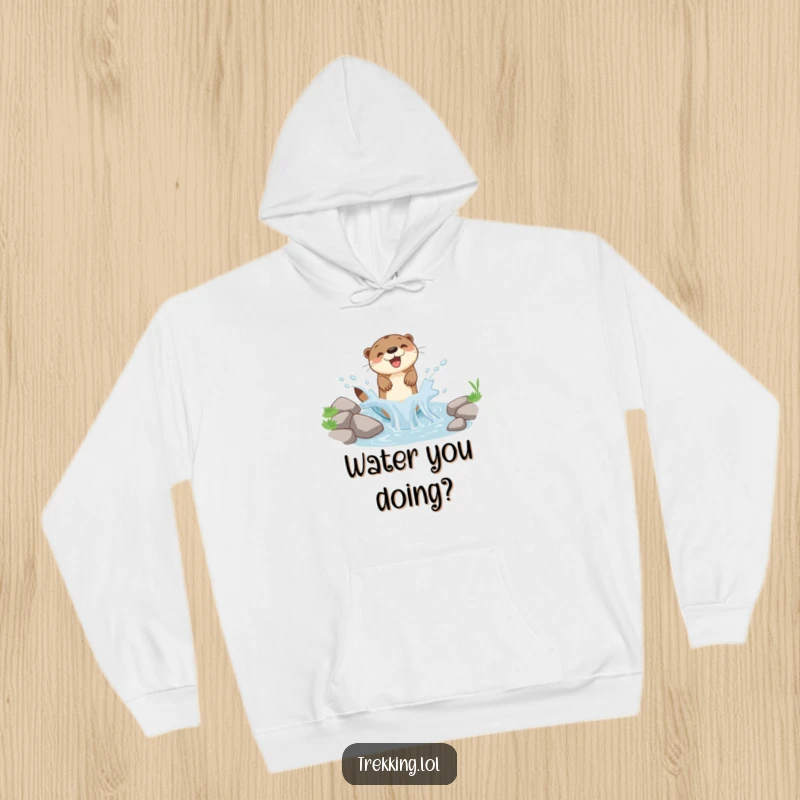 Funny hooded sweatshirt featuring a happy otter mid-splash in a small, lively mountain stream, full of energetic fun.