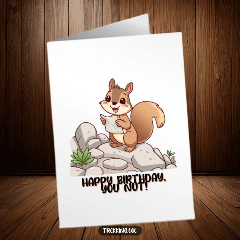Funny free printable birthday card: a cheerful squirrel happily navigating a rocky path using a map.