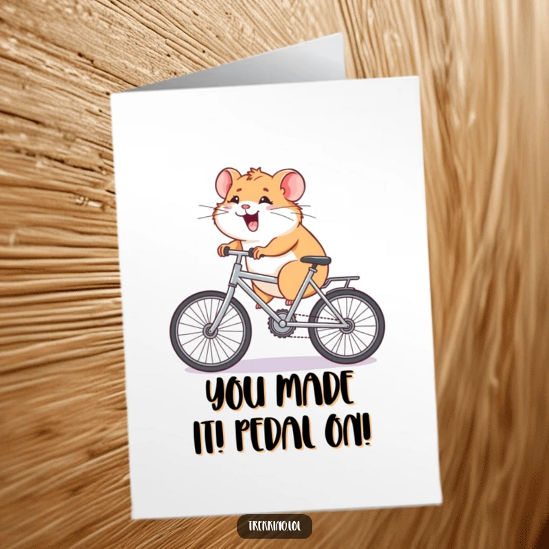 Funny Free Printable Congratulations Card showing a giggling hamster exerting immense effort pedaling a miniature bicycle uphill.